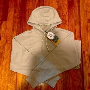 Avalanche active, light gray hoodie with splinted sides and thumb rests.